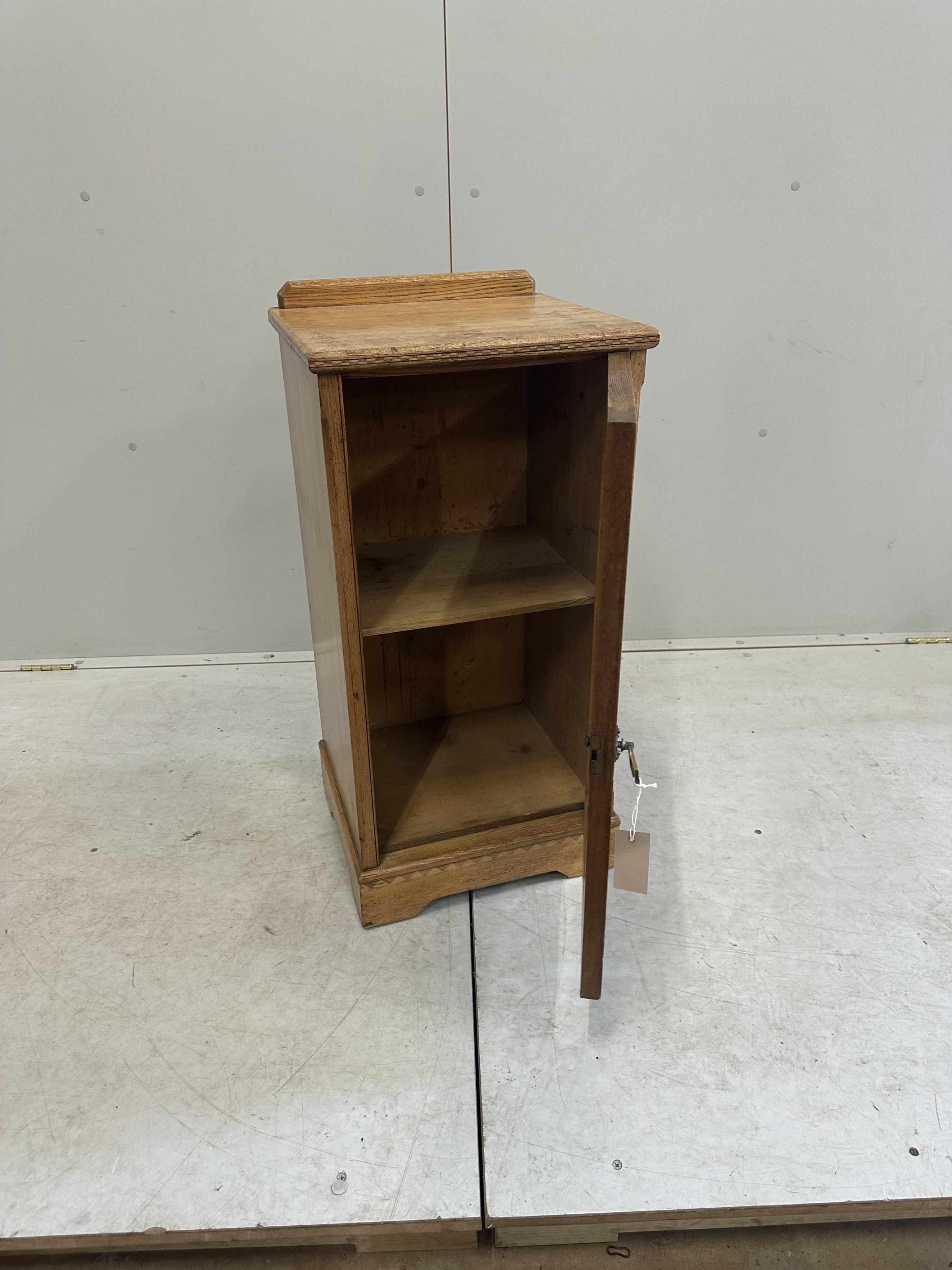 A late Victorian aesthetic movement ash bedside cabinet, width 38cm, depth 35cm, height 80cm. Condition - fair, top stained in places